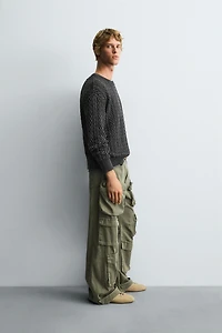 GARMENT-DYED CABLE KNIT SWEATER