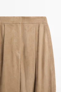 Suede leather pants with tie-detail hems