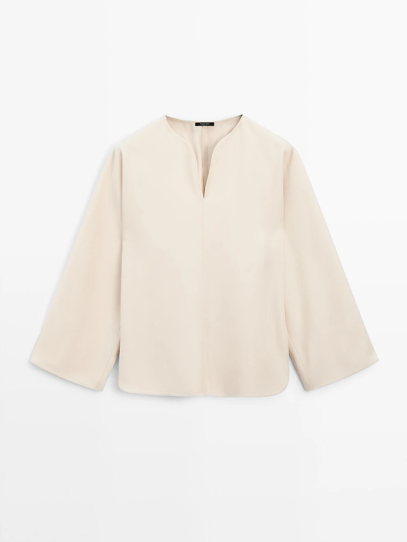 Flowing blouse with slit details