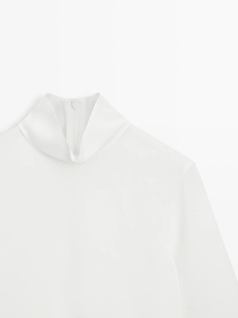 High neck blouse with hem detail