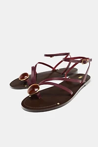 FLAT LEATHER SANDALS WITH DECORATIVE STRAPS