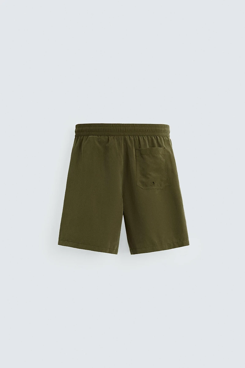 BASIC LONG SWIM TRUNKS