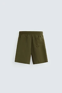 BASIC LONG SWIM TRUNKS