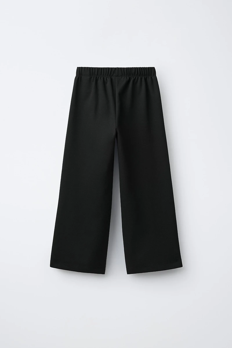 PANTALON EN MAILLE POINT ROMA À JAMBES LARGES