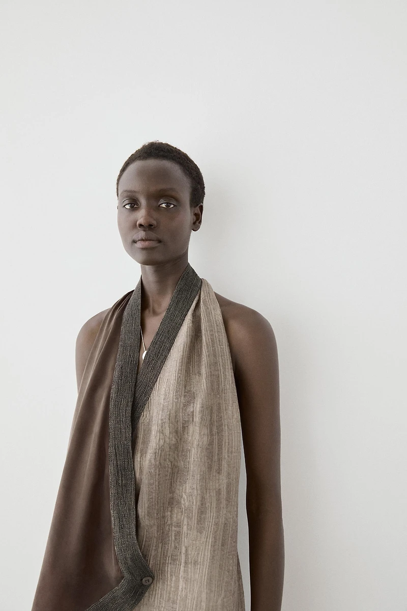 Flowing wrap top with mixed fabric detail