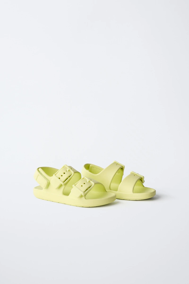 RUBBERIZED BUCKLED SANDALS