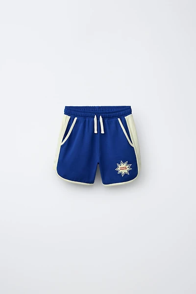 PLUSH SHORTS WITH CONTRAST PIPING