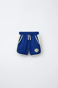 PLUSH SHORTS WITH CONTRAST PIPING