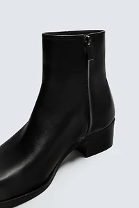 HEELED LEATHER BOOTS