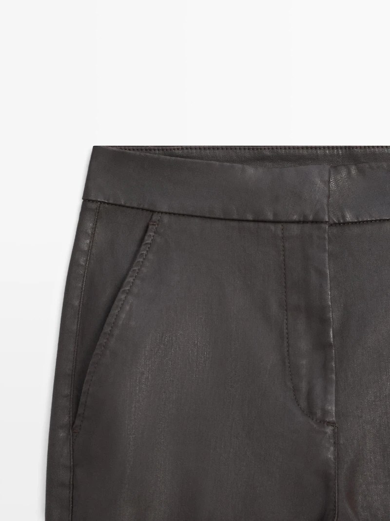 Waxed flare fit trousers