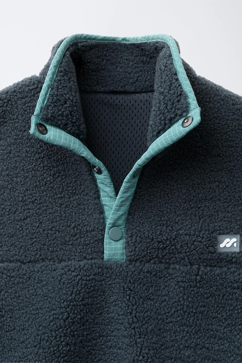FAUX SHEARLING SWEATER WITH RUBBERIZED LOGO