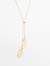 Adjustable necklace with textured pieces