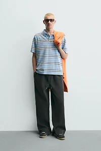 STUDDED FAUX LEATHER RELAXED FIT PANTS