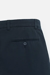 REGULAR FIT PLEATED BERMUDA SHORTS