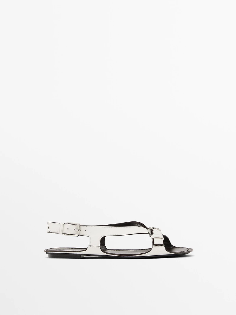Flat leather sandals with buckles