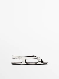 Flat leather sandals with buckles