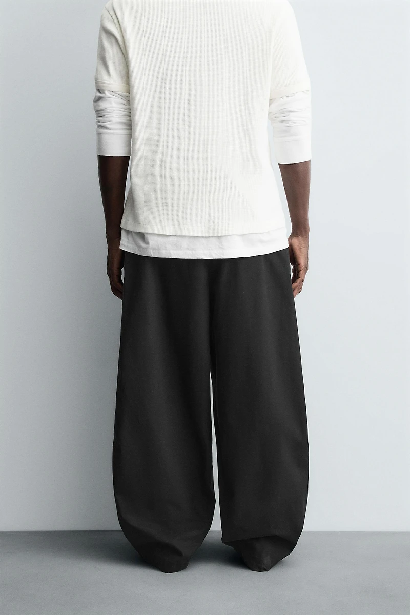 BALLOON FIT PLEATED PANTS