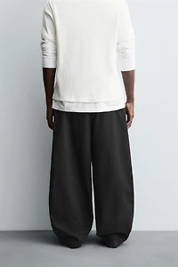 BALLOON FIT PLEATED PANTS