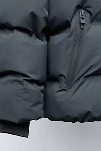 MANTEAU REMBOURRÉ ÉTIQUETTE DÉPERLANT