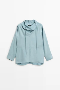 Flowing shirt with high collar and drawstring detail