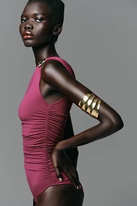 ASYMMETRIC POLYAMIDE BODYSUIT WITH METAL DETAIL