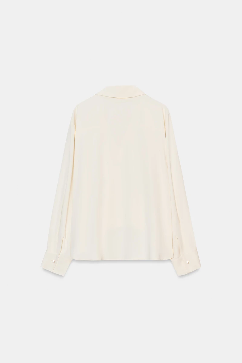 ASYMMETRIC PLEATED HEM SHIRT