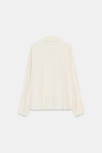 ASYMMETRIC PLEATED HEM SHIRT
