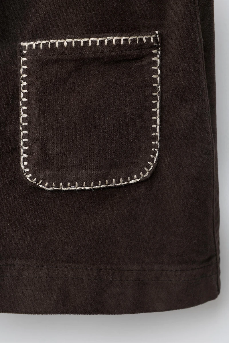 VELVET SKIRT WITH PIPING POCKETS