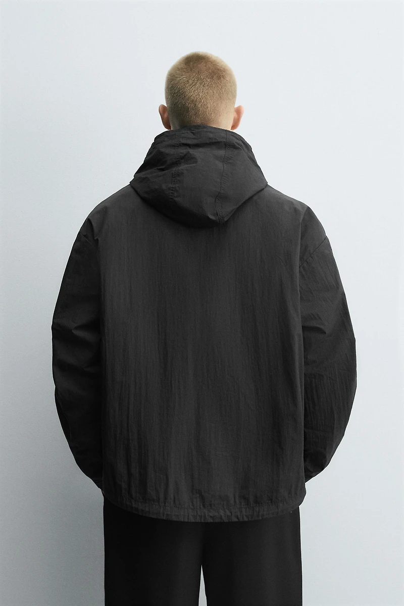 BLOUSON TECHNIQUE À CAPUCHE