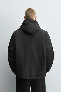 BLOUSON TECHNIQUE À CAPUCHE