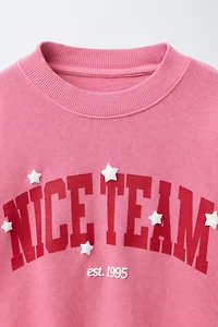 VARSITY PRINT SWEATSHIRT