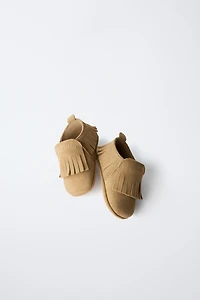CHAUSSURES EN CUIR