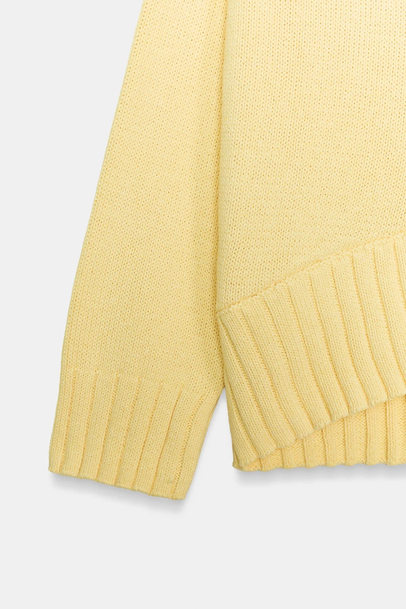 ASYMMETRIC HEM KNIT SWEATER