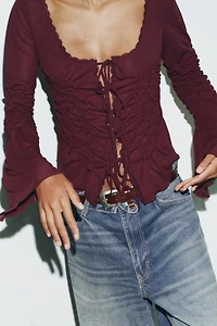 TOP À LACETS ET FRONCES