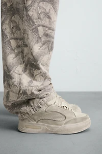 DISTRESSED THICK-SOLED SNEAKERS