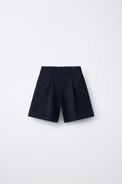 LONG PLEATED SHORTS