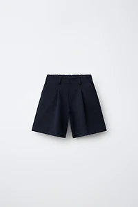 LONG PLEATED SHORTS