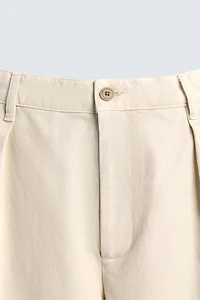 RELAXED FIT PLEATED PANTS