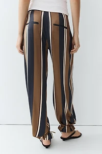Satin pants with tie-up hem detail
