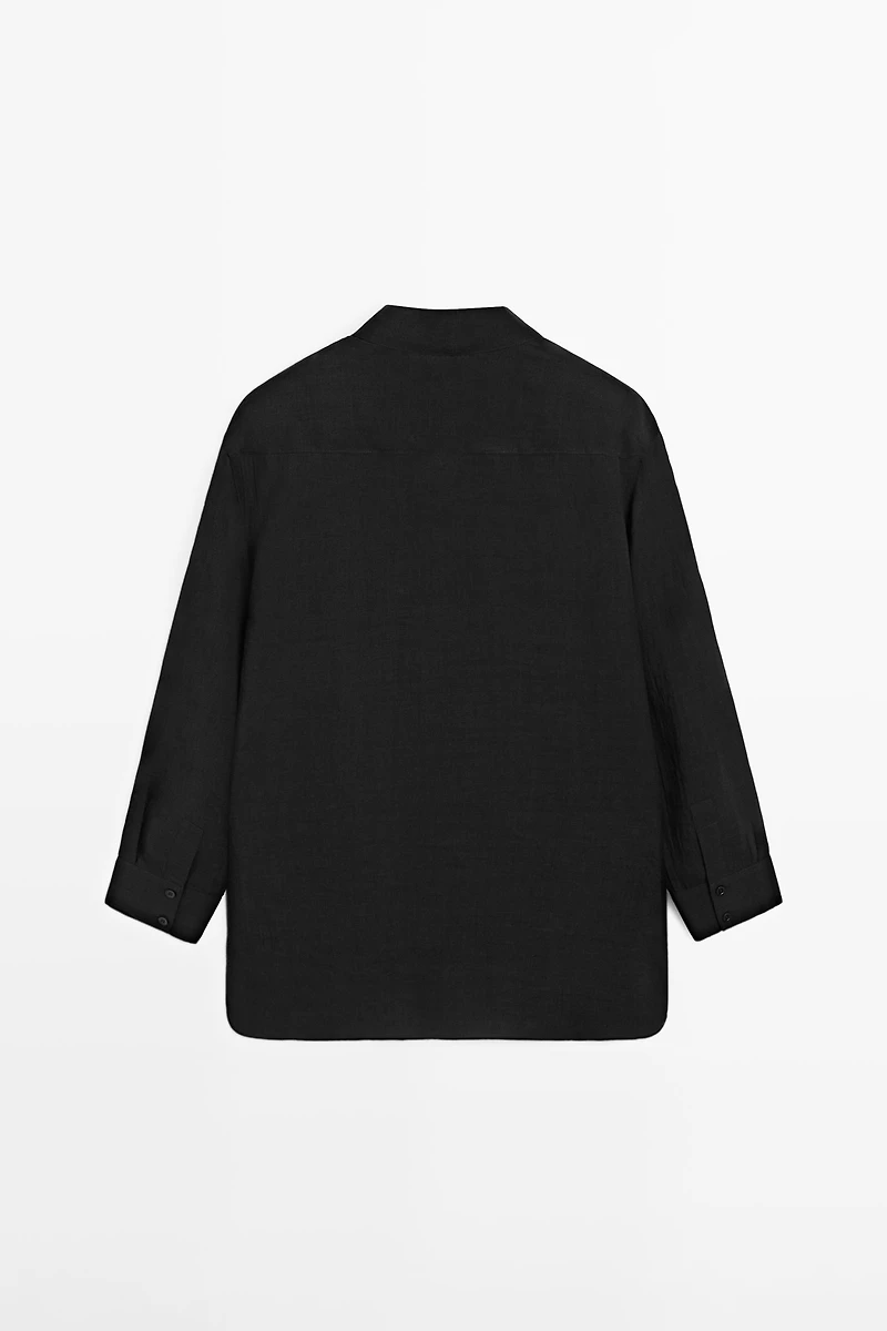 Flowing semi-sheer shirt with chest detail