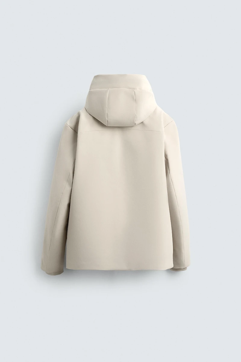 VESTE TECHNIQUE À CAPUCHE