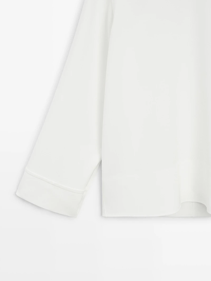 High neck blouse with hem detail