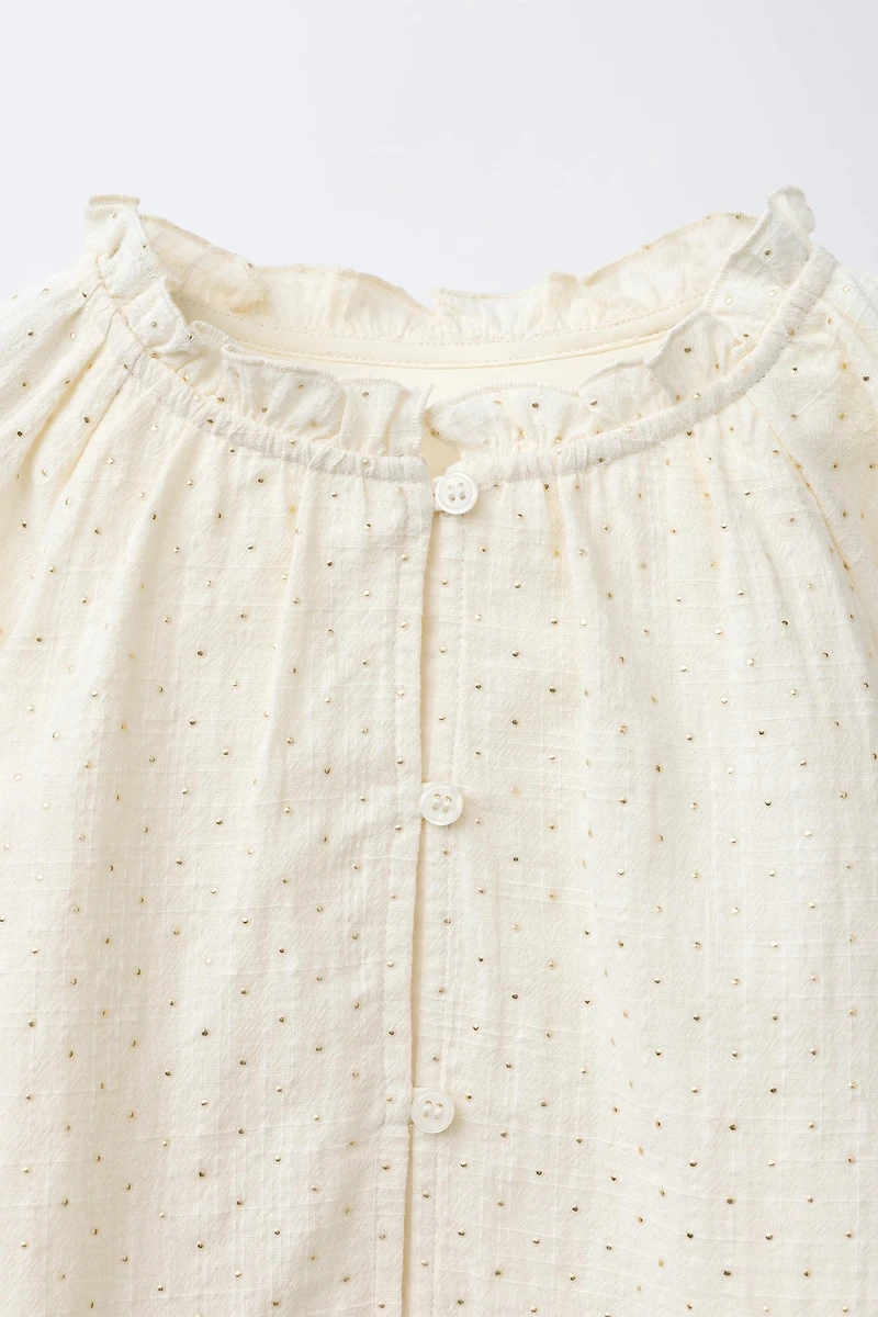 BLOUSE À CLOUS