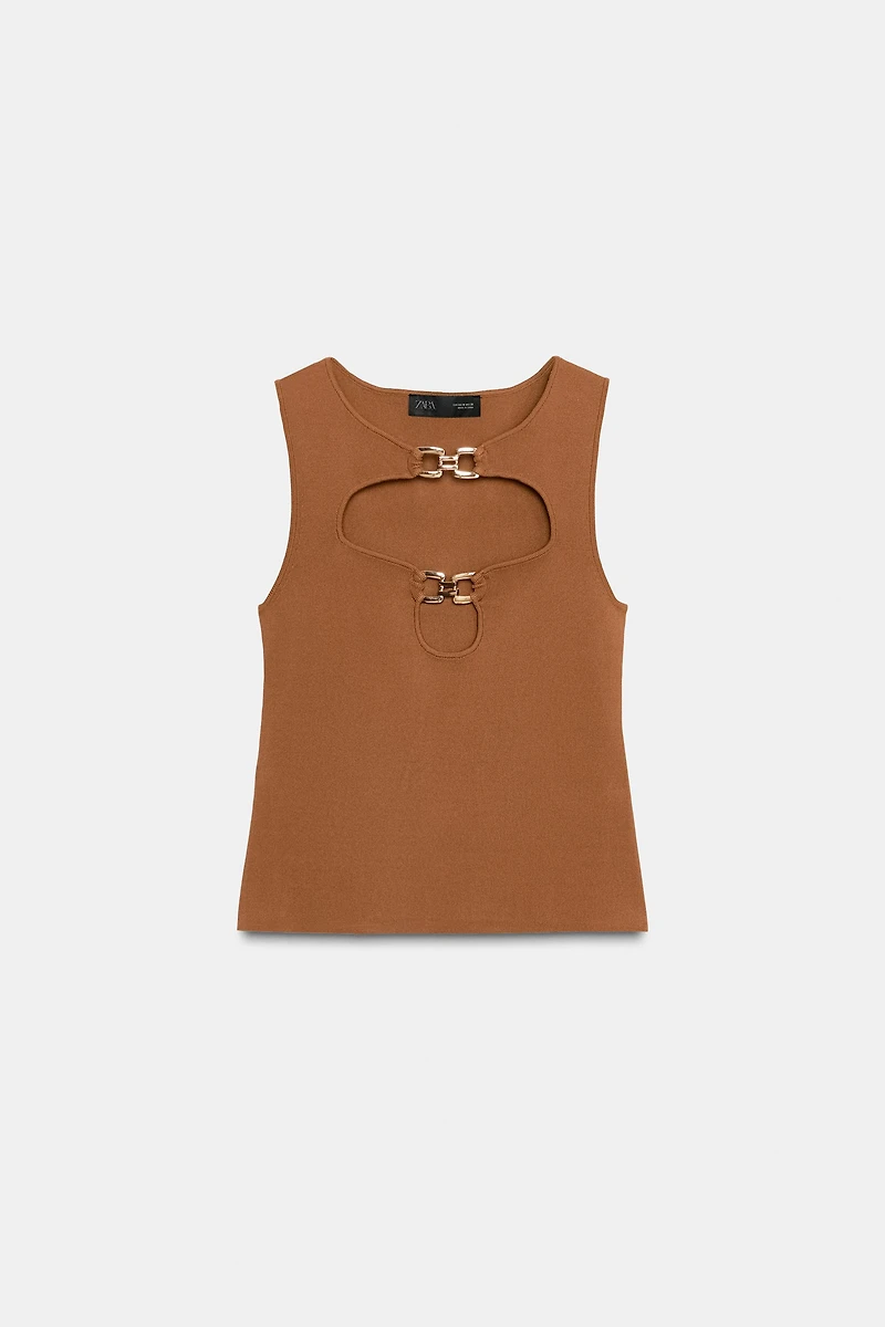 CUT OUT KNIT TOP WITH METAL DETAIL