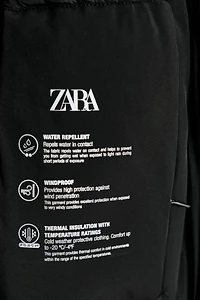 VESTE REMBOURRÉE À CAPUCHE DÉPERLANTE COUPE-VENT