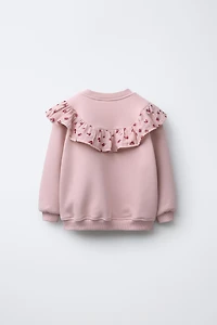 SWEAT À VOLANTS ET FLEURS