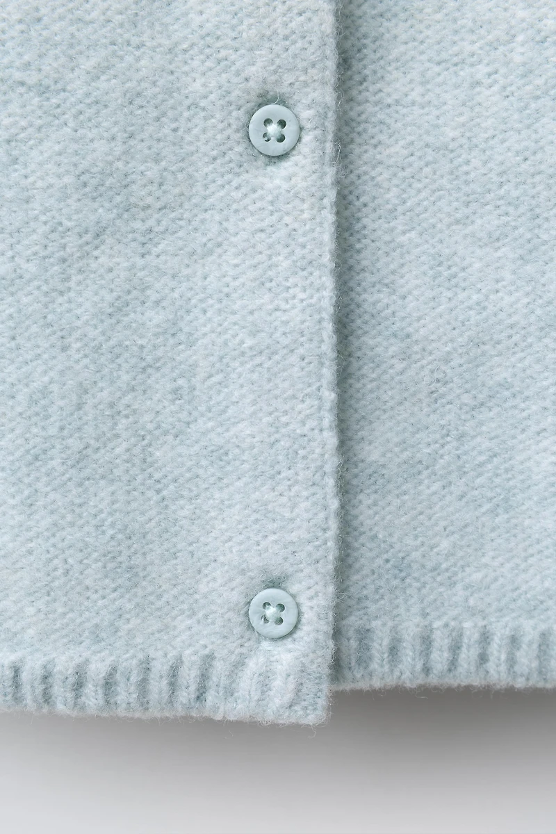 PULL EN MAILLE AVEC FEUILLES