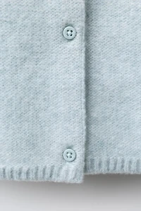 PULL EN MAILLE AVEC FEUILLES