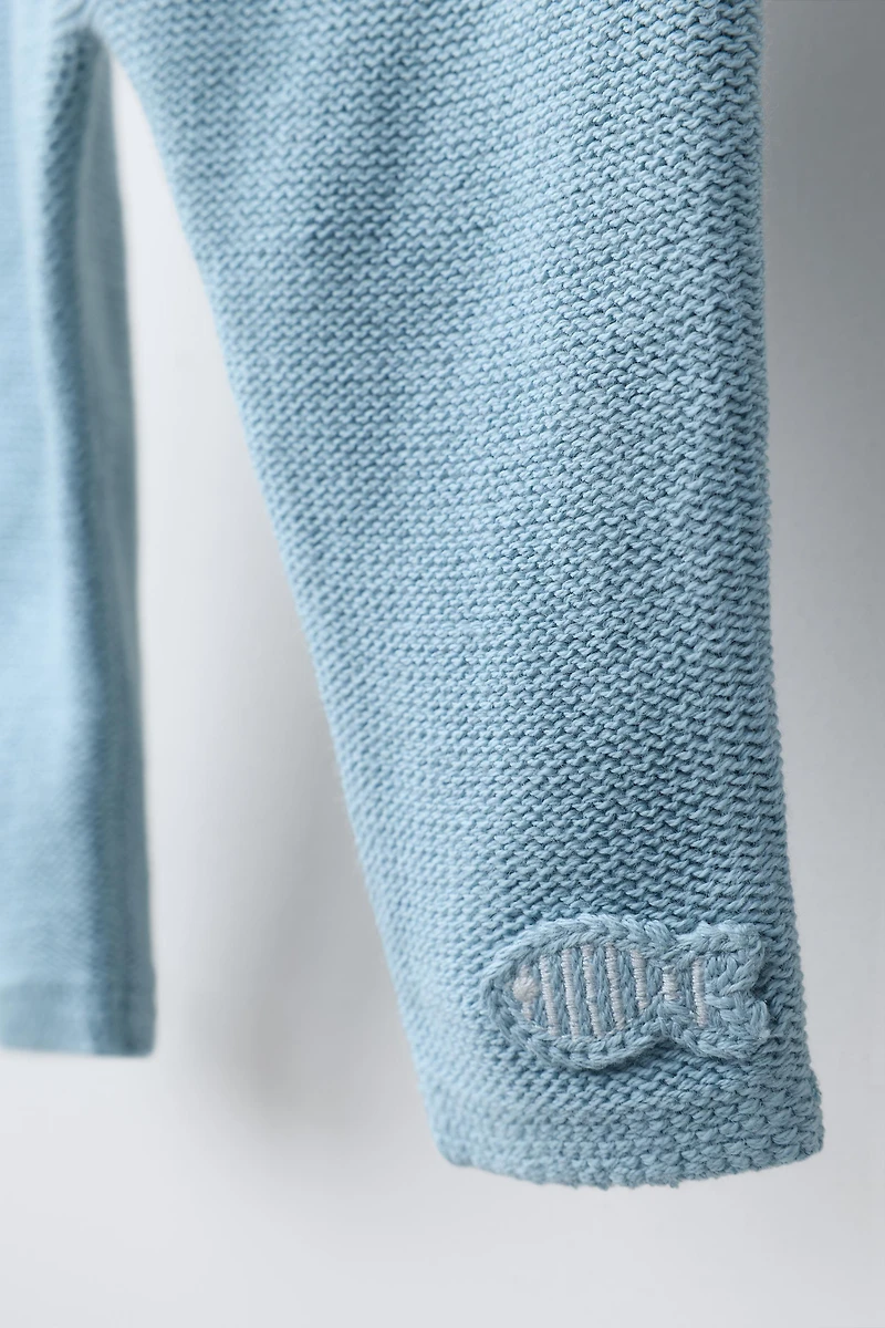 PANTALON EN MAILLE AVEC DÉCOR POISSON