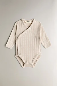 CHILDREN’S SET OF BODYSUITS